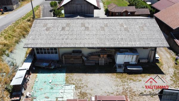 Villard (74420) Ensemble immobilier avec terrain constructible de 2 800 m² en zone UA – Villard, proche Boëge