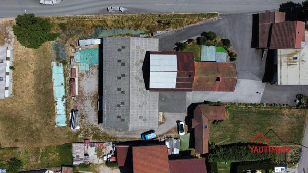 Villard (74420) Ensemble immobilier avec terrain constructible de 2 800 m² en zone UA – Villard, proche Boëge