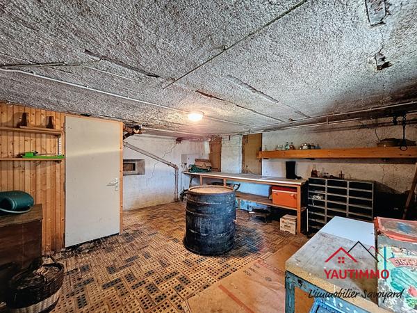 Villard (74420) Ensemble immobilier avec terrain constructible de 2 800 m² en zone UA – Villard, proche Boëge