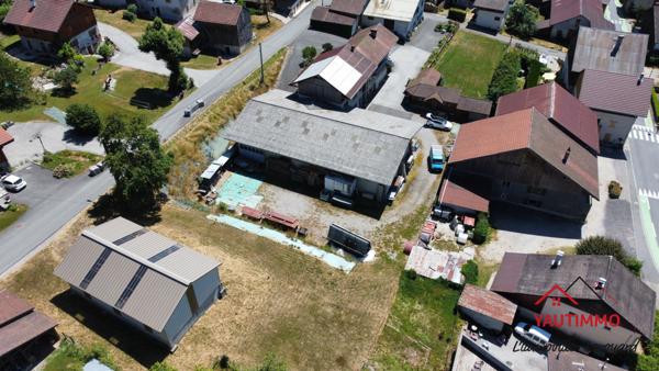 Villard (74420) Ensemble immobilier avec terrain constructible de 2 800 m² en zone UA – Villard, proche Boëge