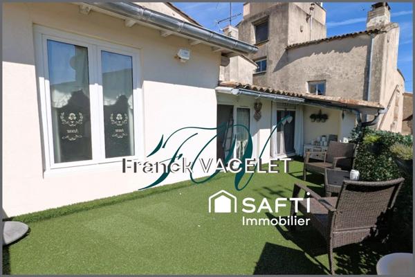 Grande demeure de caractère avec local commercial dans le centre historique