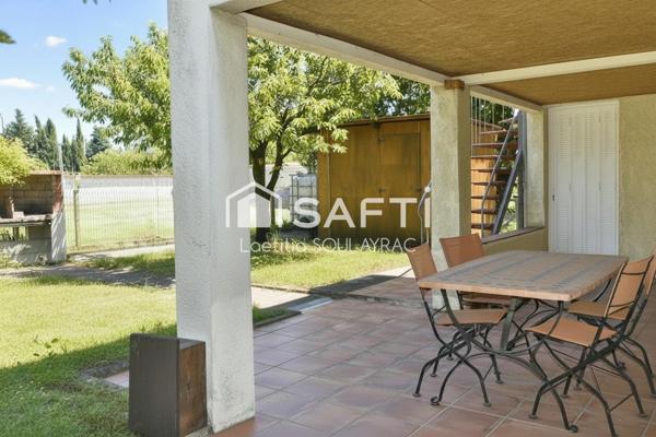 Maison 110 m² avec grand garage et jardin.