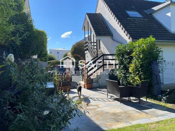 Appartement avec beau jardin et 2 chambres en centre ville