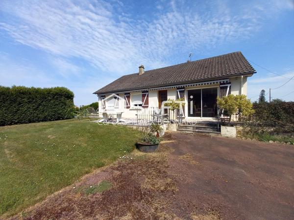 Maison avec piscine, garage et grand terrain