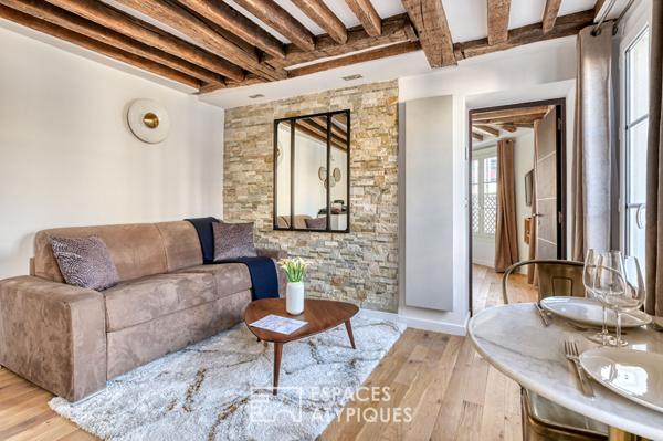 Appartement rénové avec balcon filant au coeur du Marais historique