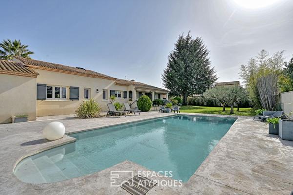 Maison rénovée avec piscine, local professionnel et son studio.