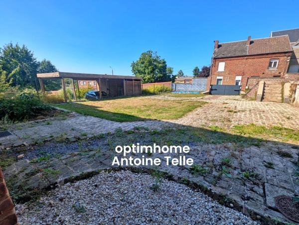 Le Cateau - Appartement en RdC avec garage, parking privatif, dépendance aménagée & jardin clos.