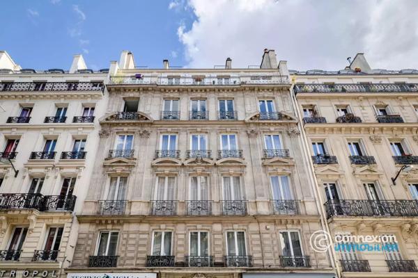 Appartement avec belle hauteur sous plafond et ascenseur