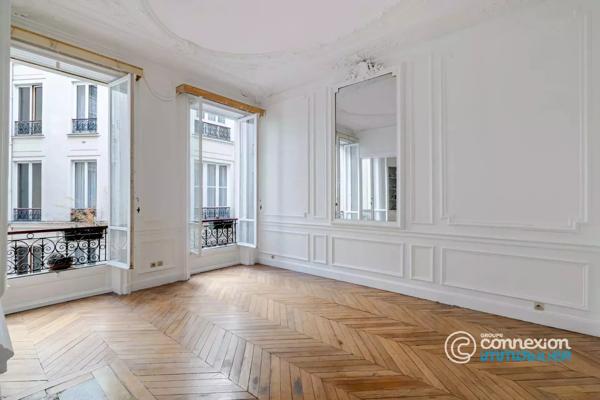 Appartement avec belle hauteur sous plafond et ascenseur