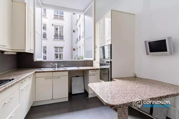 Appartement avec belle hauteur sous plafond et ascenseur