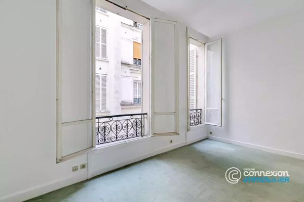 Appartement avec belle hauteur sous plafond et ascenseur
