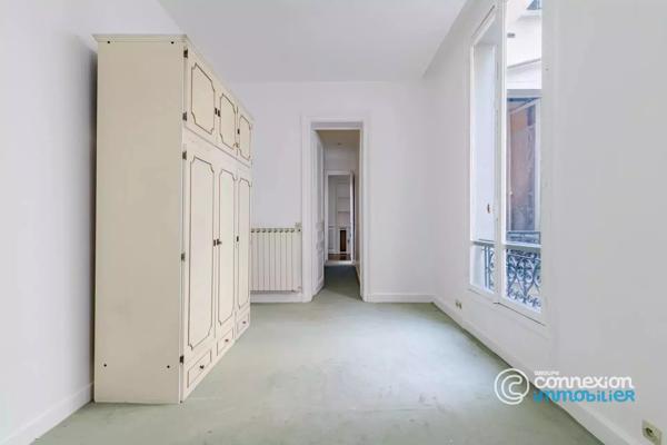Appartement avec belle hauteur sous plafond et ascenseur