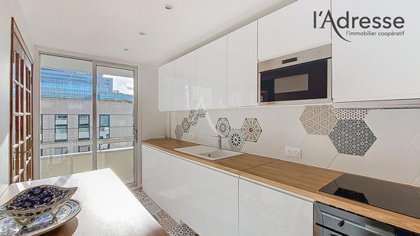 PUTEAUX/Centre ville 4/5 pièces de 97 m² avec parking boxé, 3 balcons