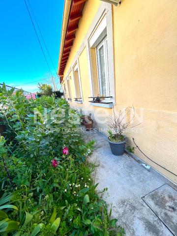 MAISON DE PLAIN PIED AVEC VERANDA ET COIN JARDIN