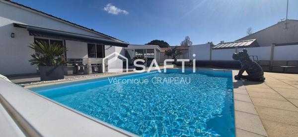 Maison aux beaux volumes sans travaux avec 3 chambres, 1 bureau, véranda avec jacuzzi et piscine chauffée, le tout sur terrain clos proche tous services.