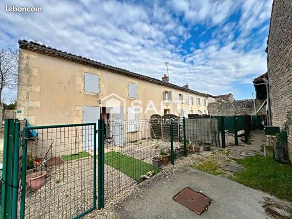 Maison divisée en 4 logements locatifs