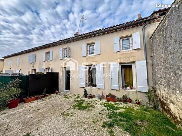 Maison divisée en 4 logements locatifs