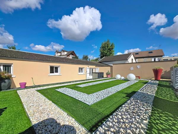 Maison a tinqueux avec parking et jardin