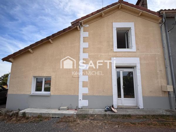 maison mitoyenne entièrement rénovée se composant de trois chambres dont une suite parentale ainsi qu'un grand séjour
