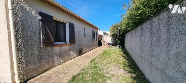 Maison d'habitation de type 3 avec garage érigée sur une parcelle de 365 m² 