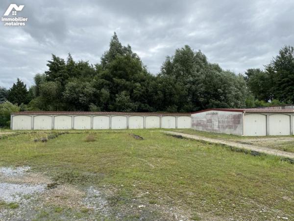 45 garages et terrain à bâtir