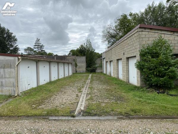 45 garages et terrain à bâtir