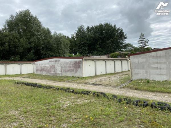 45 garages et terrain à bâtir