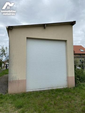 45 garages et terrain à bâtir