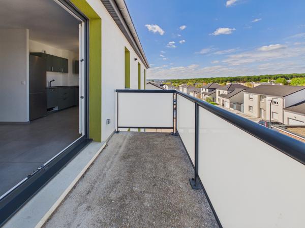 Appartement 4 pièces avec balcon et stationnements à Guénang