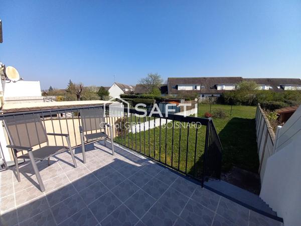 Maison jumelée atypique avec garage et jardin