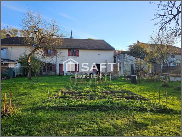 Maison à conforter avec jardin et grange.