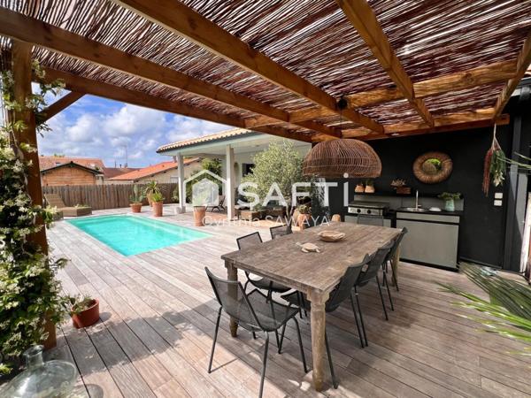 Maison moderne et charmante avec jardin paysager, terrasse et piscine