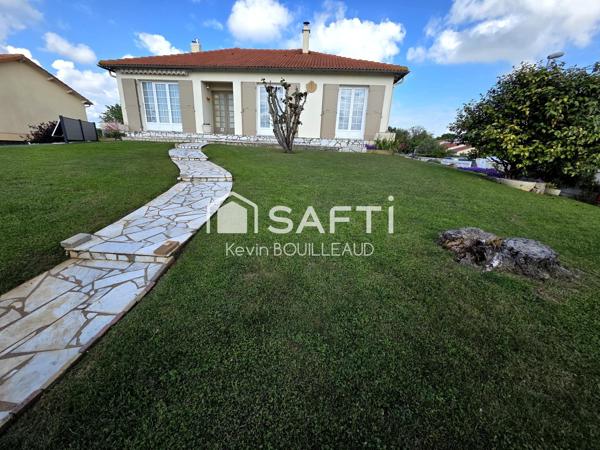 Maison plain-pied 177m², terrain 940m² avec sous-sol aménagé.