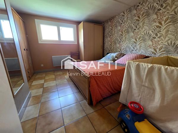 Maison plain-pied 177m², terrain 940m² avec sous-sol aménagé.