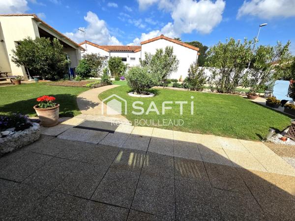 Maison plain-pied 177m², terrain 940m² avec sous-sol aménagé.