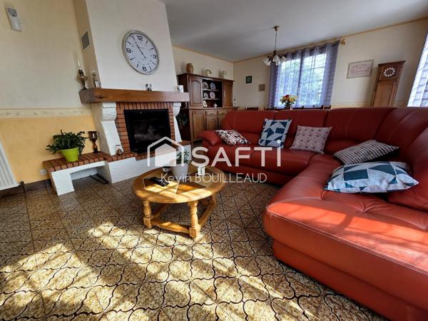 Maison plain-pied 177m², terrain 940m² avec sous-sol aménagé.