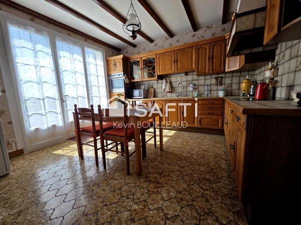 Maison plain-pied 177m², terrain 940m² avec sous-sol aménagé.