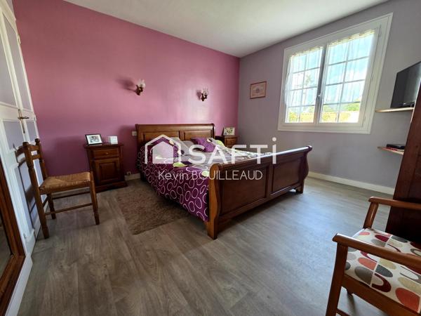 Maison plain-pied 177m², terrain 940m² avec sous-sol aménagé.