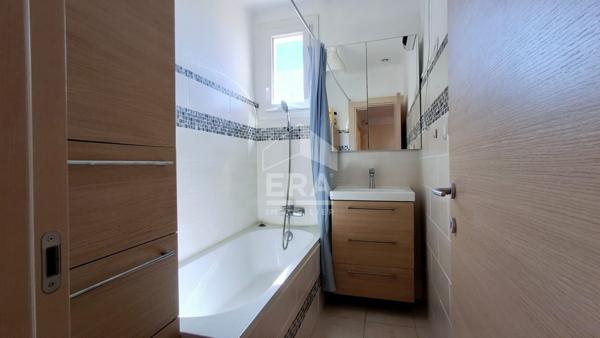 Maison 94 m² avec véranda, jardin et garages à vendre à Perpignan