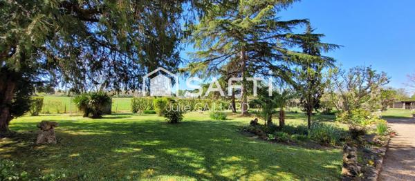 Maison en pierre sur un parc arboré de 4453 m2