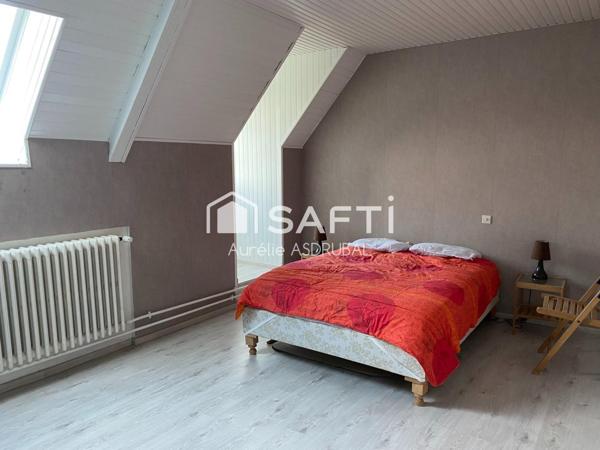 Belle maison style périgourdin avec jardin et grand garage.