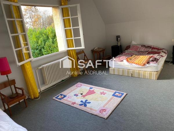 Belle maison style périgourdin avec jardin et grand garage.