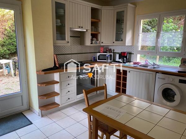 Belle maison style périgourdin avec jardin et grand garage.