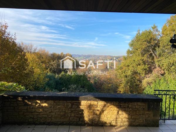 Belle maison style périgourdin avec jardin et grand garage.