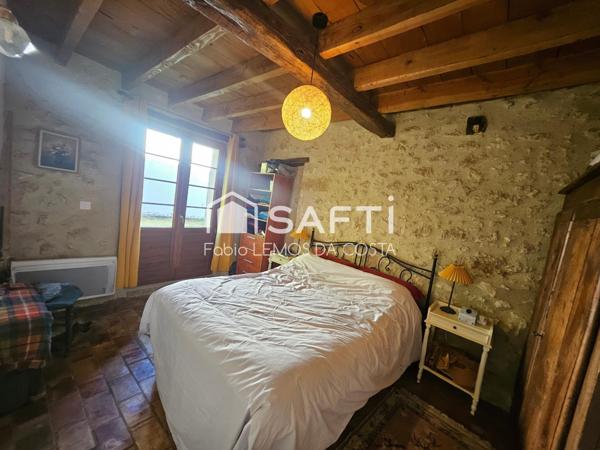 PROPRIÉTÉ EN PIERRE AVEC DEPENDANCE SUR 2,4 HECTARES