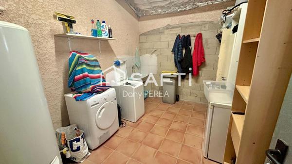 Charmante villa de 115 m2, deux chambres, deux salles d'eau, jardin et garage.