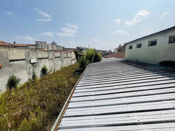 Ensemble immobilier idéalement situé avec un fort potentiel