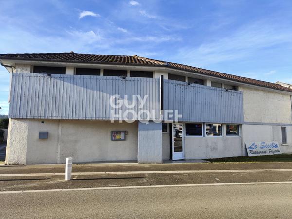 Local commercial loué et logements à créer