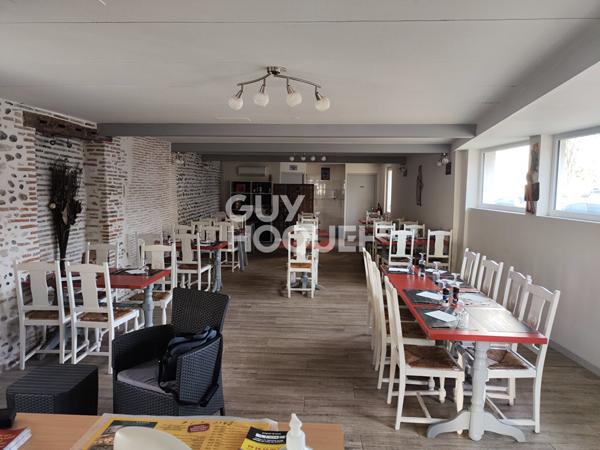 Local commercial loué et logements à créer