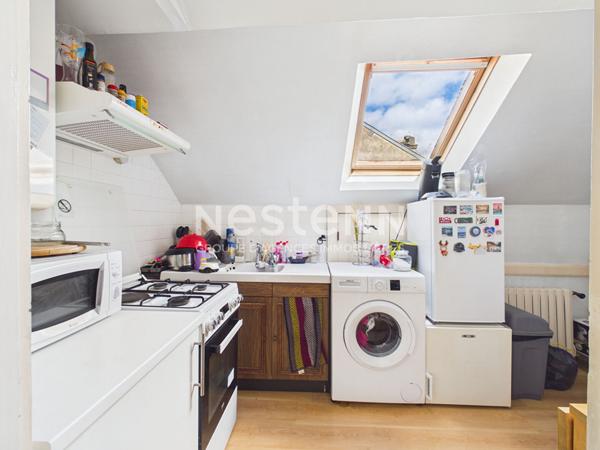 Aurillac, proche rue des Carmes, à Vendre Immeuble 4 appartements, avec garage et jardin.